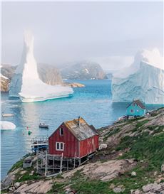 Dennis Lehtonen Documents a Pair of Immense Icebergs Paying a Visit to a Small Greenland Village