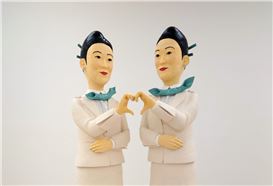 Behind a Flight Attendant’s Painted-On Smile