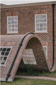 A Rippling Townhouse Facade by Alex Chinneck Takes a Seat in a London Square