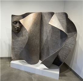 Evocative Faces Emerge From Surreal Sculptures of Gigantic Book Pages